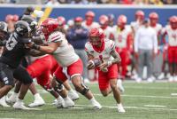 Arizona extends winning streak, rolls past West Virginia 52-31