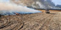 Farmers asked to stop harvesting due to grass fires in the area