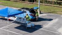 Florida Army National Guard Soldiers distribute aid...