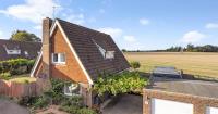 Detached house with open views and garden office on the market for £525,000