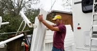 Residents of Alabama, Florida clean up from Isaias