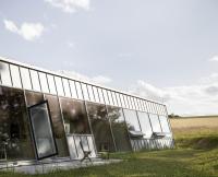 A sloping facade brings the forest inside this house in the Czech Republic