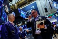 Nasdaq falls ahead of earnings, economic data while oil rallies