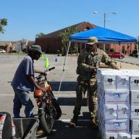 Florida National Guard Soldier distribute water,...