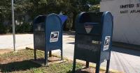 A Metro Atlanta woman missing $500 in checks, claims no lock on USPS collection box