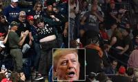 Trump rally descends into chaos as screaming protesters are dragged from Ohio stadium
