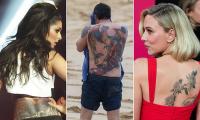 Tat wasn't a good idea! Experts reveal which celebs have regrettable body art - and whose stand the test of time - as Scarlett Johansson unveils giant back tattoo