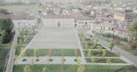 fifty oak trees and stone-paved clearing shape contemporary italian piazza by ghisellini architetti