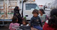 Photos show displaced Syrian Kurdish families returning to damaged homes after seven years