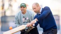 Prince William halts traffic outside Buckingham Palace as he plays cricket with sports stars