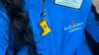 Former N.L. culture minister handed out taxpayer-funded rubber boot keychains in France