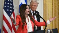 The rise and fall of Trump’s ‘lady in red’ who was never out of the headlines