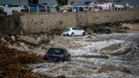 Apocalyptic flash floods rip through Greek holiday islands leaving one dead as roads turn into rivers & cars swept away