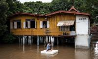Thailand’s Villages Deliberately Flooded to Shield Capital from Rising Waters