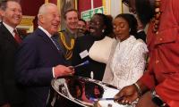 King of music! Charles couldn't resist playing the steel pans during palace reception
