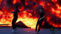 Buildings burn & huge blazes in middle of street as rioters clash with cops during anti-government protests in Albania