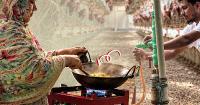 Cooking gas from chicken droppings, costing just Tk 1,200 a month