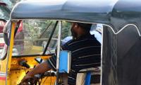 Auto drivers lap up phones at the wheel; passengers face the music