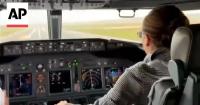 Thailand's Queen Suthida pilots a plane from Bangkok to Japan