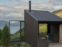 This New Zealand Tiny Cabin’s Glass Sliders Are So Big They Hang Off the Side