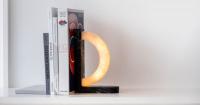 hollowed quartzite and steel form concav book, a magnetic bookend luminaire