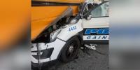 Police officer crashes patrol car into school bus stopped picking up children; 4 sent to hospital
