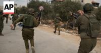 Israeli settlers attack West Bank olive harvesters and set vehicles on fire