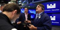 Retail investors are piling into AI stocks, while institutional money is turning defensive