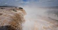 El Niño rains flood South America, sending residents fleeing and cattle swimming