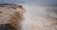 El Niño rains flood South America, sending residents fleeing and cattle swimming