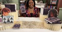 Local Lawrence author releases debut novel 'A Cage of Flowers'