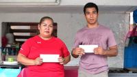 Lobster processor settles with 2 migrant workers in lost wages case