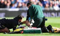 Chelsea star Emiliano Martinez rushed to hospital after sickening head injury during Everton clash - as Argentina goalkeeper is BOOED while stretchered off