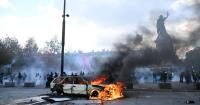 Scuffles and fires break out as protesters rally across France