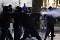 Albania Protests In Photos: Hooded Demonstrators Hurl Fireworks As Police Fire Tear Gas