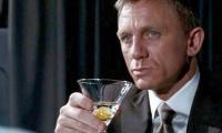 James Bond is 'too glamorous' to be a traditional British spy says new 007 author who claims espionage reality is more 'cups of tea than cocktails'