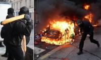 French rioters hurl baguettes at police as violent protests spread across Europe - with buildings set on fire, cars overturned and hundreds arrested