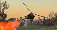Watch: Stunt Chopper at Navy SEAL Fundraiser Thrills Guests With Small Explosions and Red, White and Blue Smoke Show