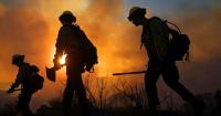 Southern California fire burns homes as winds intensify