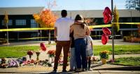 Oregon teacher fought school attacker before armed dad shot suspect