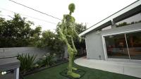 Artist Turns Home Depot’s 12-Foot Skeleton Into a Giant Living Chia Pet