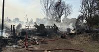 Fire in southeast Nampa consumes around 2 acres of land, destroys buildings and vehicles