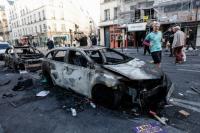 France shaken after hellish night: Town halls torched, rioters and looters in several cities, as Macron faces political fire