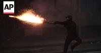 Anti-government protesters and riot police clash in Albania