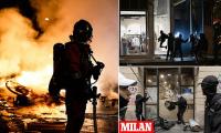 Shocking images emerge from Paris after night of devastation amid violent protests across Europe as Trump blames 'immigration' for the spiraling mayhem