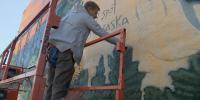 Muralist paints his way across Nebraska with vibrant stop in Long Pine