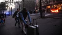 Tourists trade cafes for barricades in France gripped by unrest