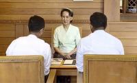 Rare photos of Myanmar's Suu Kyi getting letters from British king released