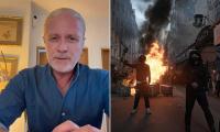 French football legend Emmanuel Petit says migrants who 'do not love my country' should 'go back to where you came from' following days of protest violence