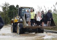 'This is a disaster': Oliva resident who survived 1987 floods rescued by digger after terrifyng night in attic